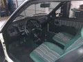 Peugeot 205 Green - kleiner weißer Löwe