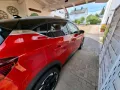 Mitsubishi Fast Neu,und ziemlich Rot, mit schwarzem D...